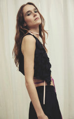the poetry of her vest